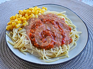 Spaghetti bolognese and corn