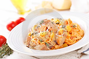 Spaghetti bolognese pasta with tomato sauce, vegetables and chicken meat on white wooden rustic background. Traditional italian fo