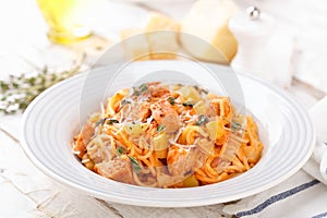 Spaghetti bolognese pasta with tomato sauce, vegetables and chicken meat on white wooden rustic background. Traditional italian fo