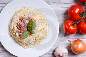 Spaghetti with bolognese sauce and ingredients. top view