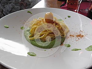 Spaghetti with bottarga on asparagus sauce . Italian recipe