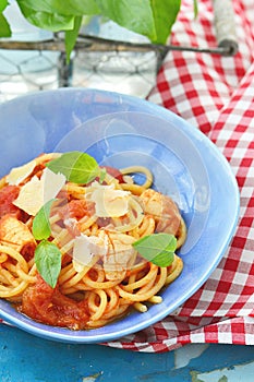 Spaghetti with calamary tomatoes and basil