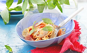 Spaghetti with calamary tomatoes and basil