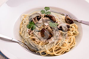 Spaghetti carbonara with brown mushroom