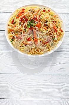 Spaghetti with cracked Crab legs, top view