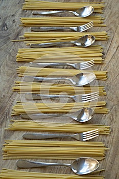 spaghetti and cutlery alternated