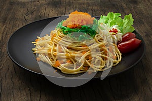 Spaghetti Ebiko and Seaweed salad decorate Leek flower shape and vegetable. Japanese combination italian Food