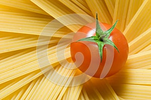 Spaghetti and a fresh tomato