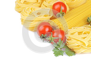 Spaghetti and frutchini with cherry tomatoes and parsley. Isolated.