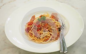 Spaghetti with Garlic, Dried Chili and Bacon in white plate, food