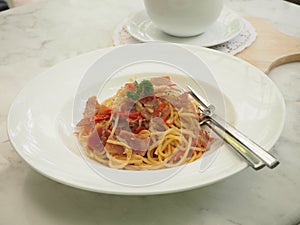 Spaghetti with Garlic, Dried Chili and Bacon in white plate, food