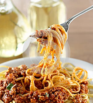 Spaghetti hanging on a fork at dinner