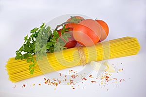 Spaghetti.Ingredients for pasta on a white background.