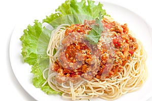 Spaghetti meat sauce ready to serve on white plate, on white background isolated