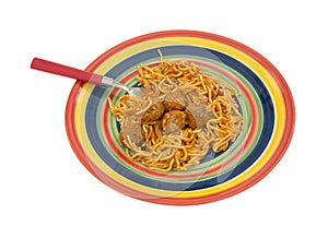 Spaghetti and meatball dinner on dish with fork