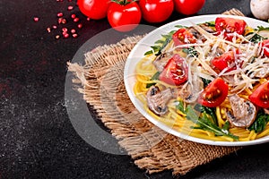 Spaghetti with mushrooms, cheese, spinach, rukkola and cherry tomatoes