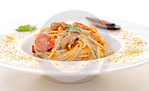 Spaghetti with mussels bottarga fish and cherry tomatoes