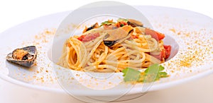 Spaghetti with mussels bottarga fish and cherry tomatoes