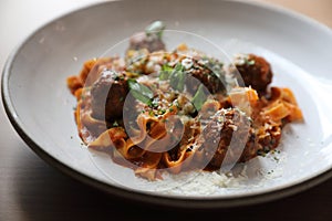 Spaghetti pasta with beef meatballs and tomato sauce on a plate , italian food