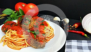 Spaghetti pasta with meatballs and tomato sauce