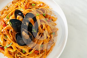 Spaghetti pasta with mussels or clams and tomato sauce