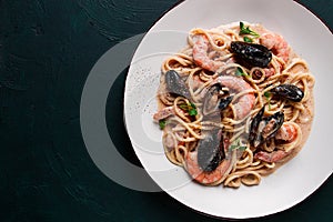 Spaghetti, pasta, with seafood, shrimp with mussels, in creamy garlic sauce, homemade, no people,