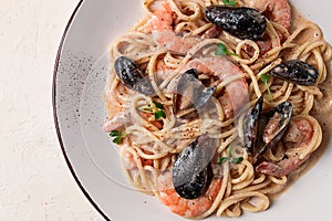 Spaghetti, pasta, with seafood, shrimp with mussels, in creamy garlic sauce, homemade, no people,