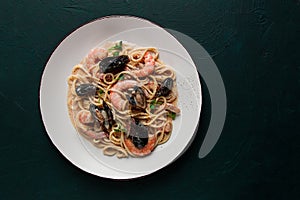 Spaghetti, pasta, with seafood, shrimp with mussels, in creamy garlic sauce, homemade, no people,