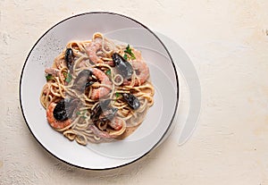 Spaghetti, pasta, with seafood, shrimp with mussels, in creamy garlic sauce, homemade, no people,