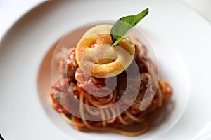 Spaghetti Pasta with Tomato Sauce, Smiley Potato fry. Traditional Italian Food