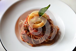 Spaghetti Pasta with Tomato Sauce, Smiley Potato fry. Traditional Italian Food