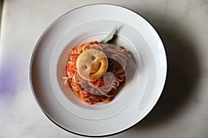 Spaghetti Pasta with Tomato Sauce, Smiley Potato fry. Traditional Italian Food