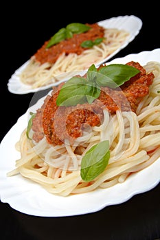 Spaghetti ragu alla bolognese sauce on black,close up