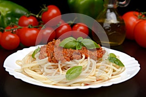 Spaghetti ragu alla bolognese sauce on black,close up