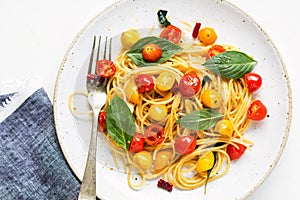 Spaghetti with red and yellow cherry tomato