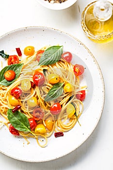 Spaghetti with red and yellow cherry tomato