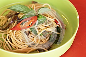 Spaghetti sausage with chilli and basil