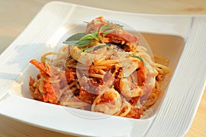 Spaghetti seafood with tomato concasse photo