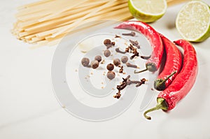 spaghetti and seasonings for preparation/spaghetti and seasonings for preparation on a white background. Copy space