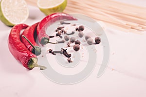 spaghetti and seasonings for preparation/spaghetti and seasonings for preparation on a white marble background. Toned