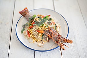 Spaghetti with spicy lobsters in white plate