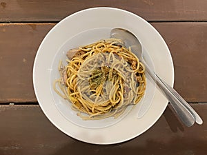 Spaghetti with spicy tuna sauce and oregano served on a plate