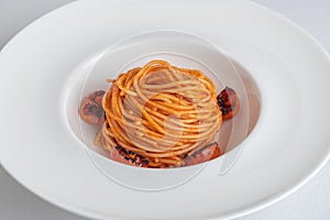 Spaghetti with tomato sauce and burned tomatos