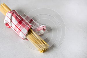 Spaghetti Yellow Pasta Ready for Cooking Gray Background Copy Space