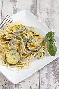 Spaghetti with zucchini and pine nuts