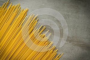 Spaghettii on top stone background.