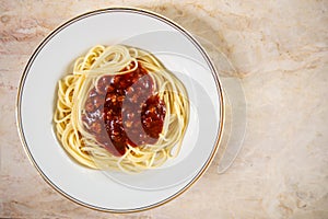 Spaghtti red sauce in white plate. Italian food. Top view with c