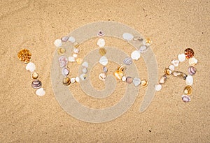 Spain Balearic Islands, Ibiza writing with seashells on sand beach