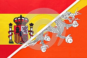 Spain and Bhutan, symbol of two national flags from textile. Partnership between European and Asian countries