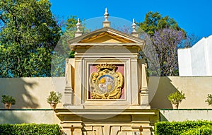 Spain Coat of Arms in garden of the Royal Alcazars of Seville, Andalusia, Spain.